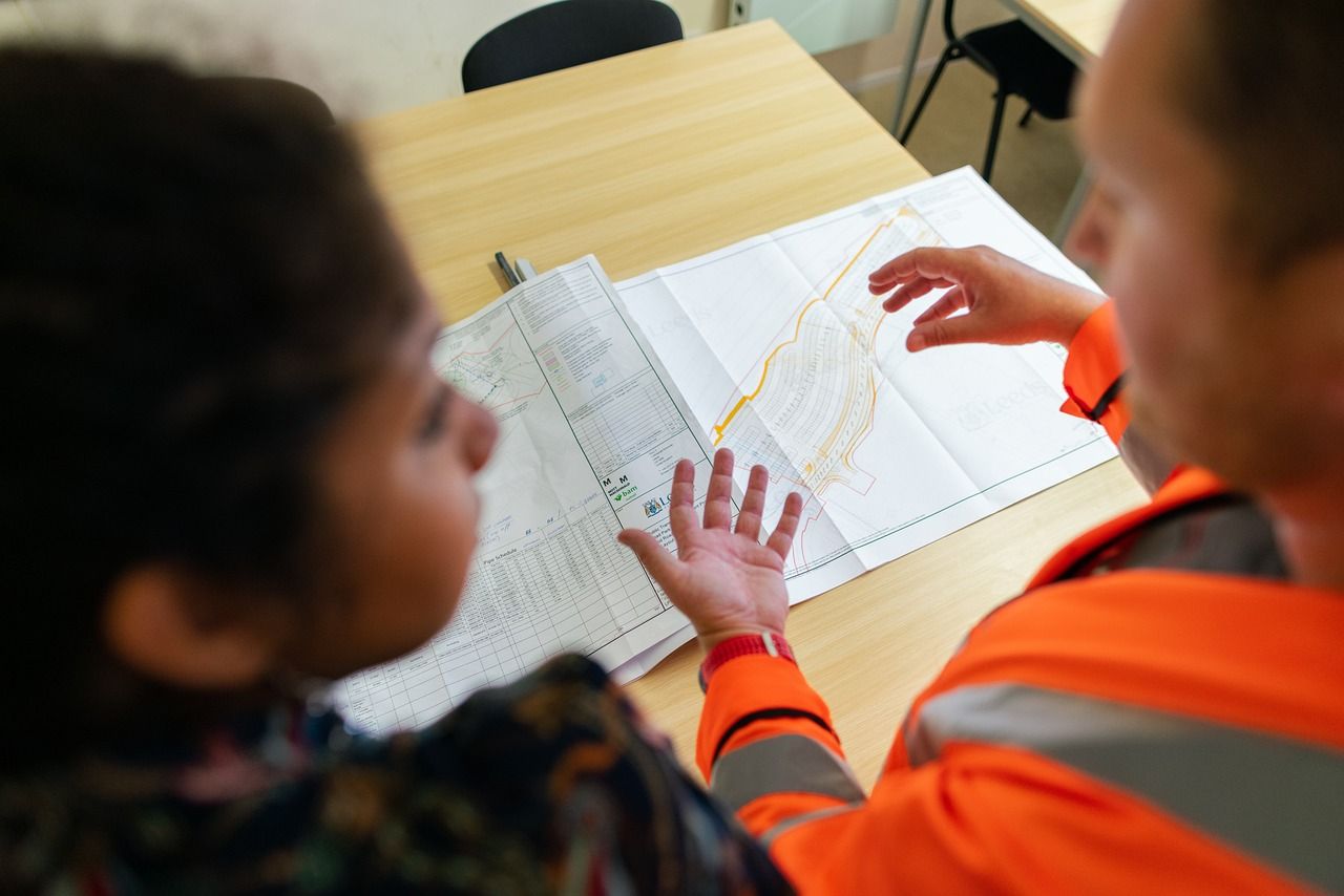TDS engineers reviewing drainage plans on site